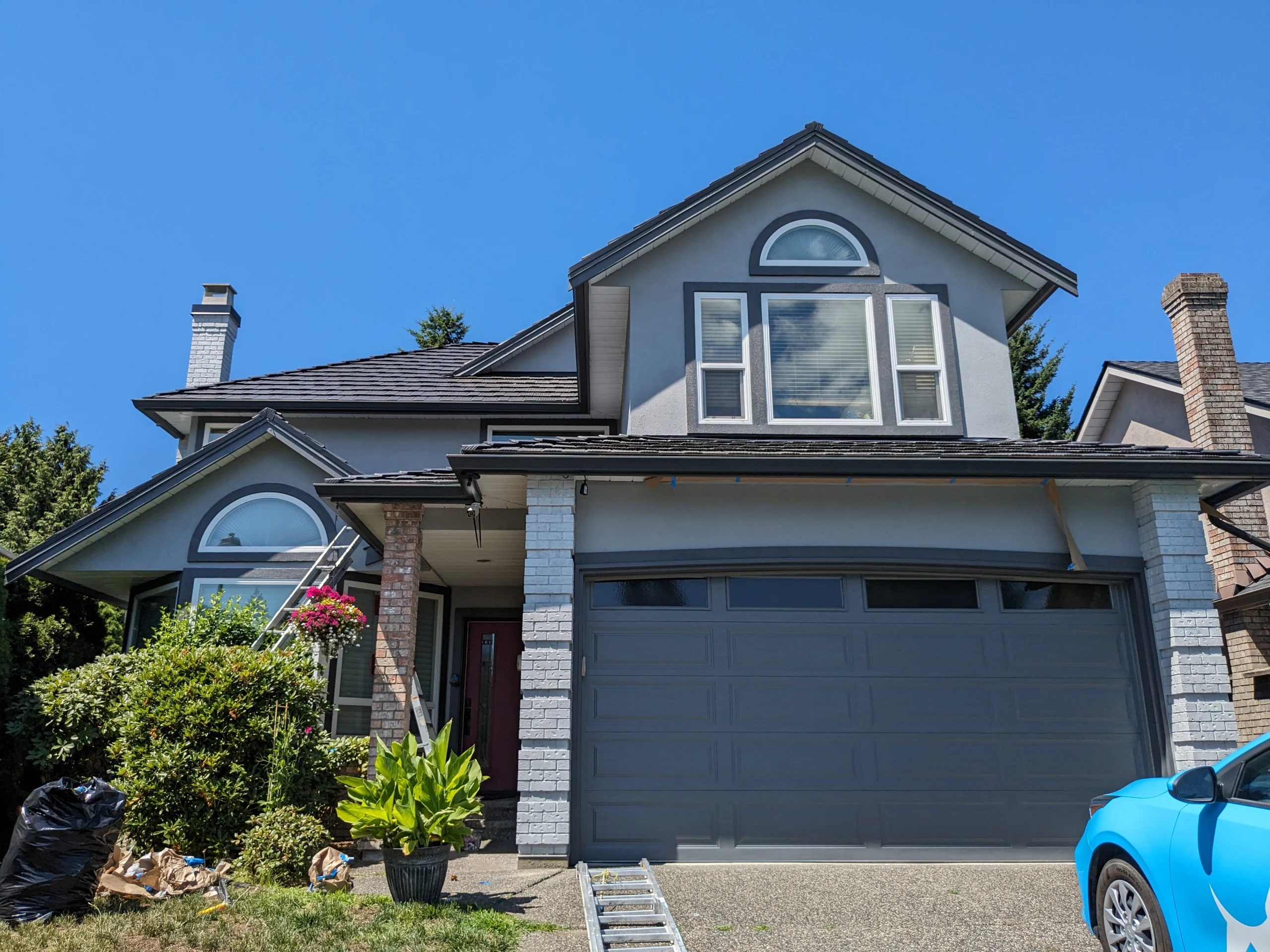 Freshly painted residential exterior siding and architectural trim