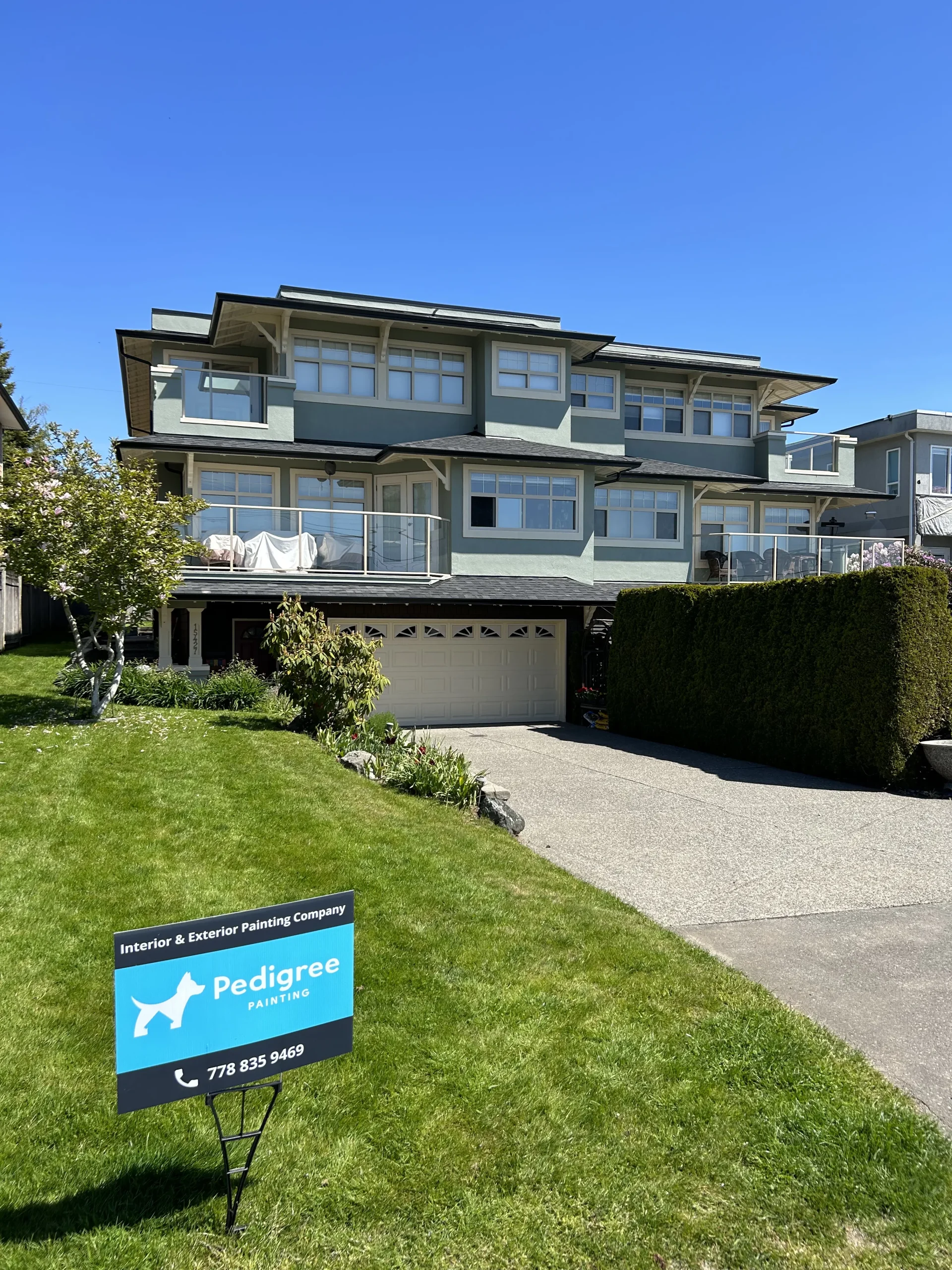 Residential house exterior showing siding and trim painting