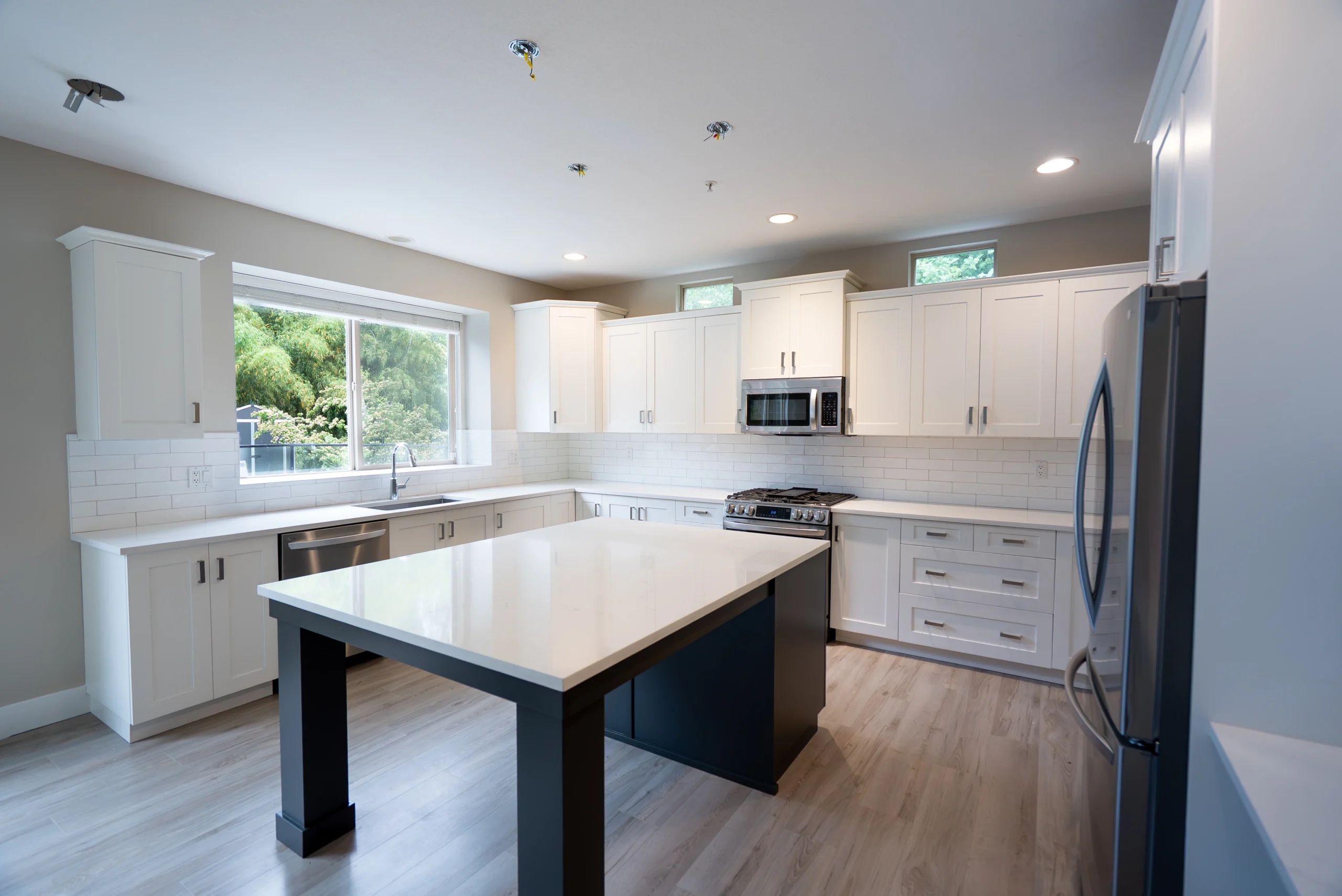 Kitchen with white painted cabinets